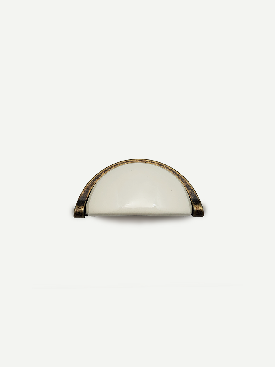 Semi-circular ceramic cabinet handle for contemporary interiors.