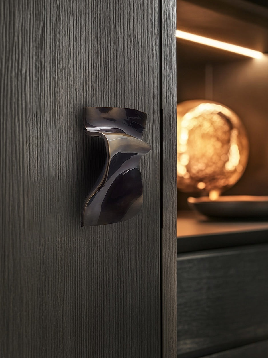 Dark wooden cabinet with bronze cabinet pull