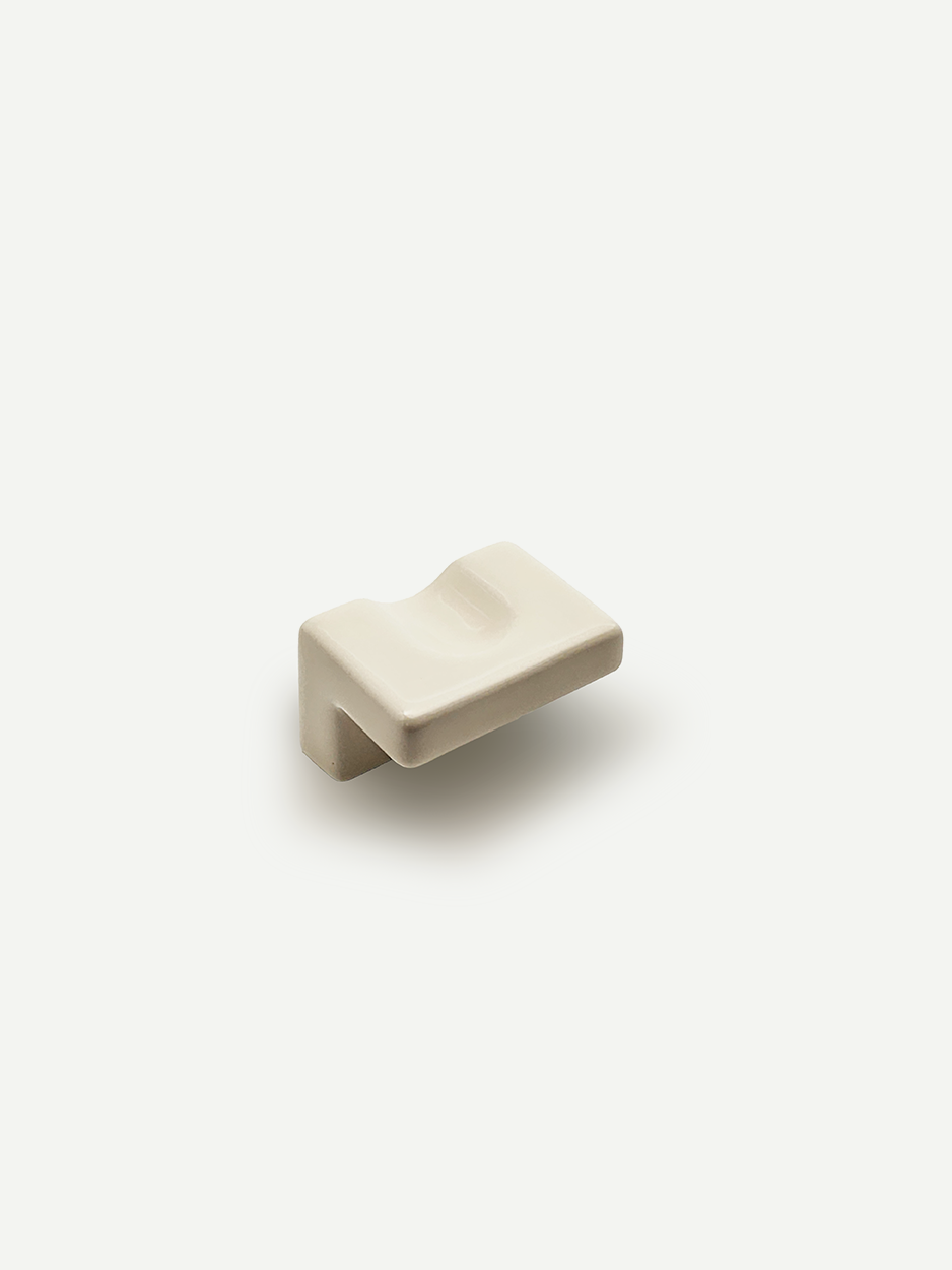 Ceramic knobs chosen by interior designers for modern kitchen drawers and cabinets.
