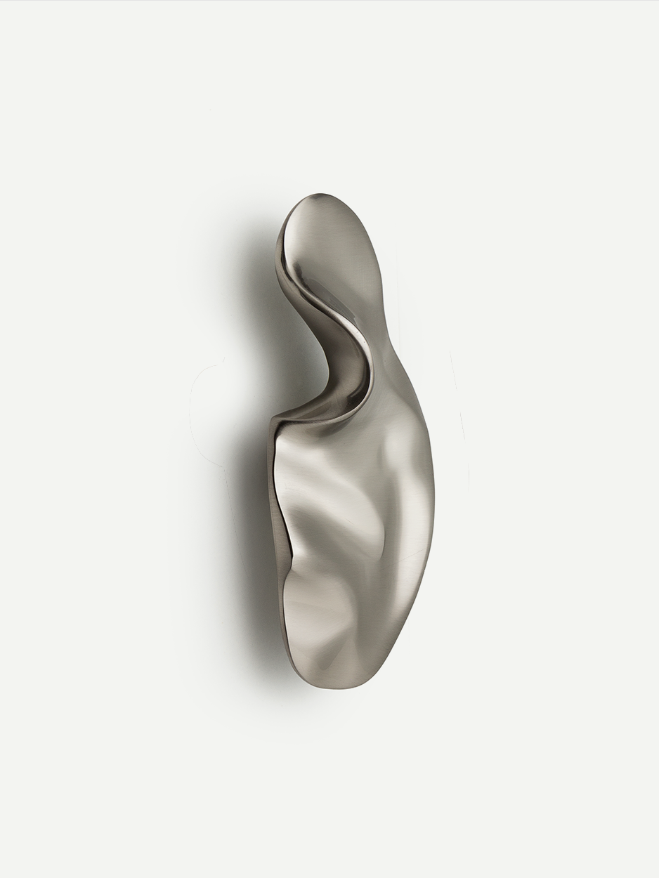 Designer hand-sculpted knobs for bespoke dresser drawers.