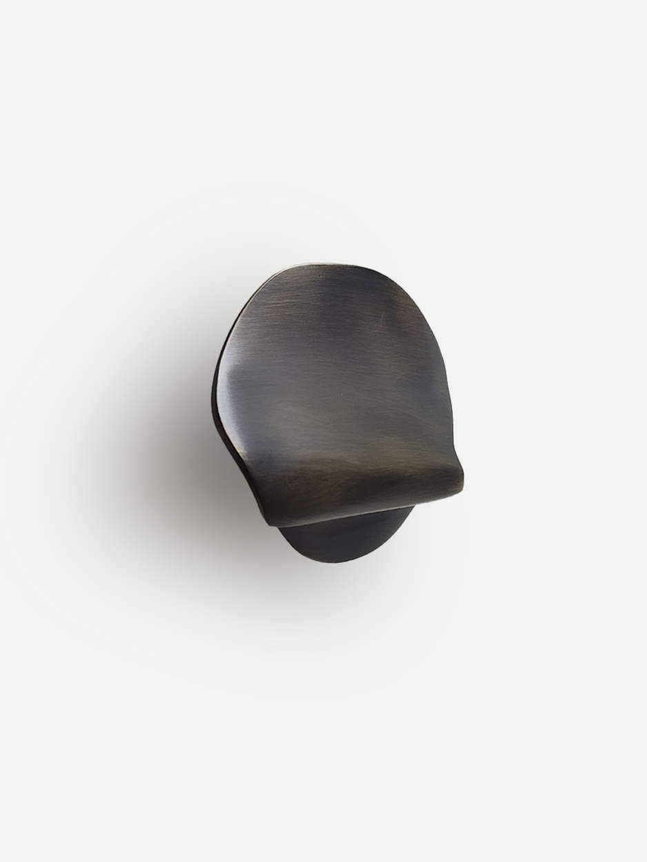 Solid brass sculpted cabinet knobs and pulls for luxury kitchens in unlaquered bronze 