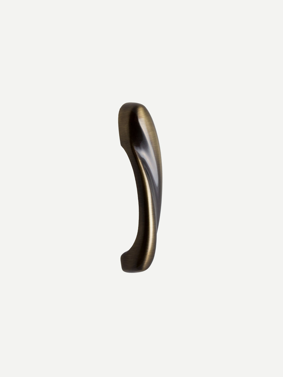 Modern sculpted cabinet pulls crafted in solid brass