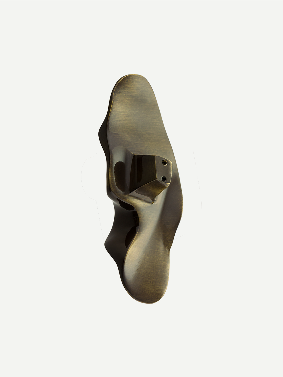 Solid brass knobs for modern dresser drawers.